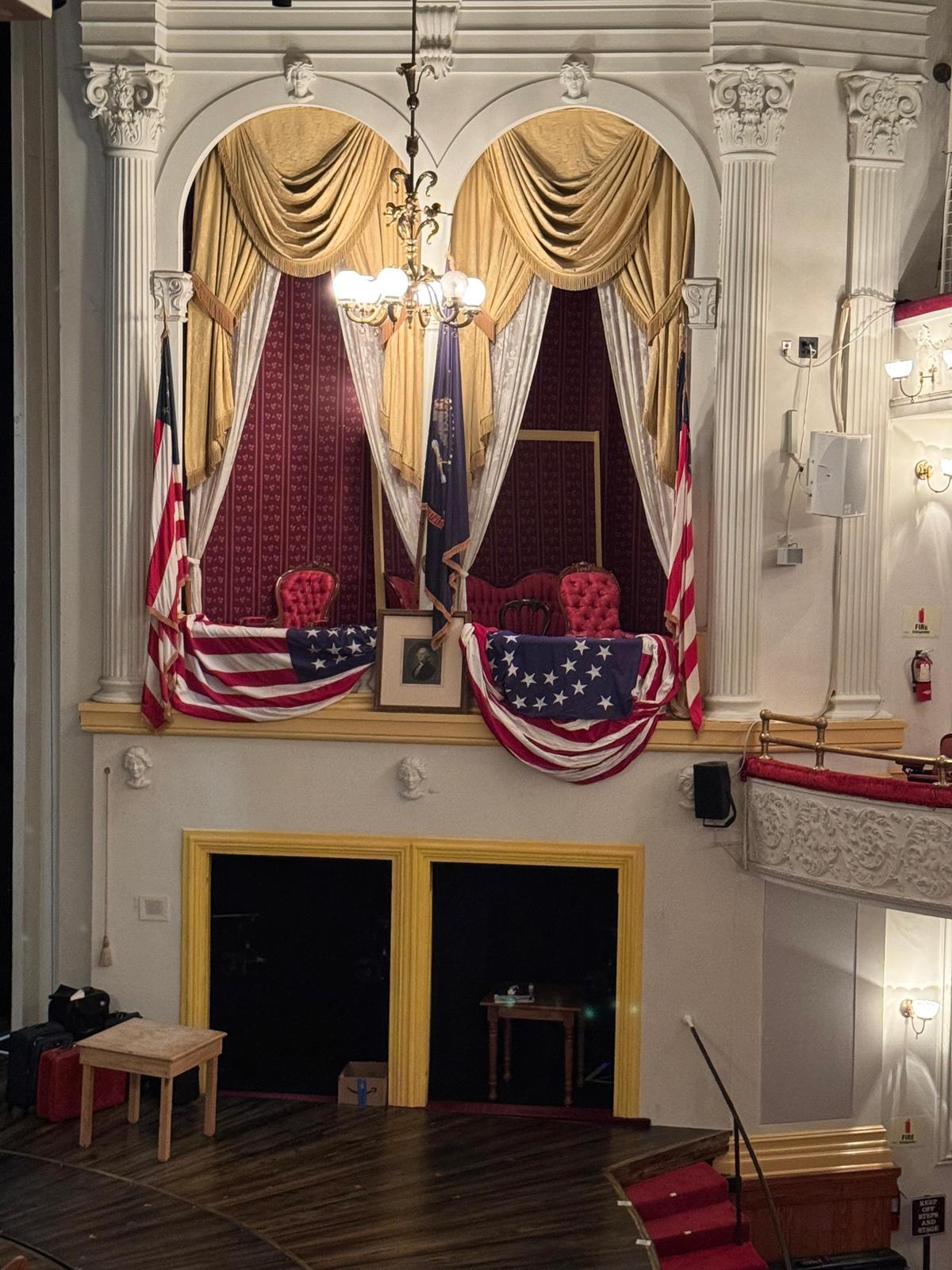 The restored presidential box at Ford's Theatre, draped in bunting and flags, where Lincoln was shot